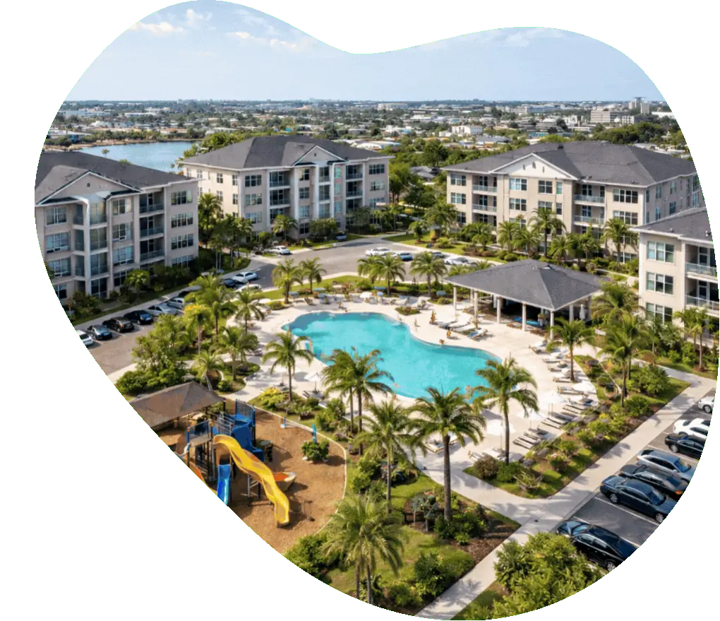 Aerial view of an Arba Living multifamily community, with pool and landscaped grounds
